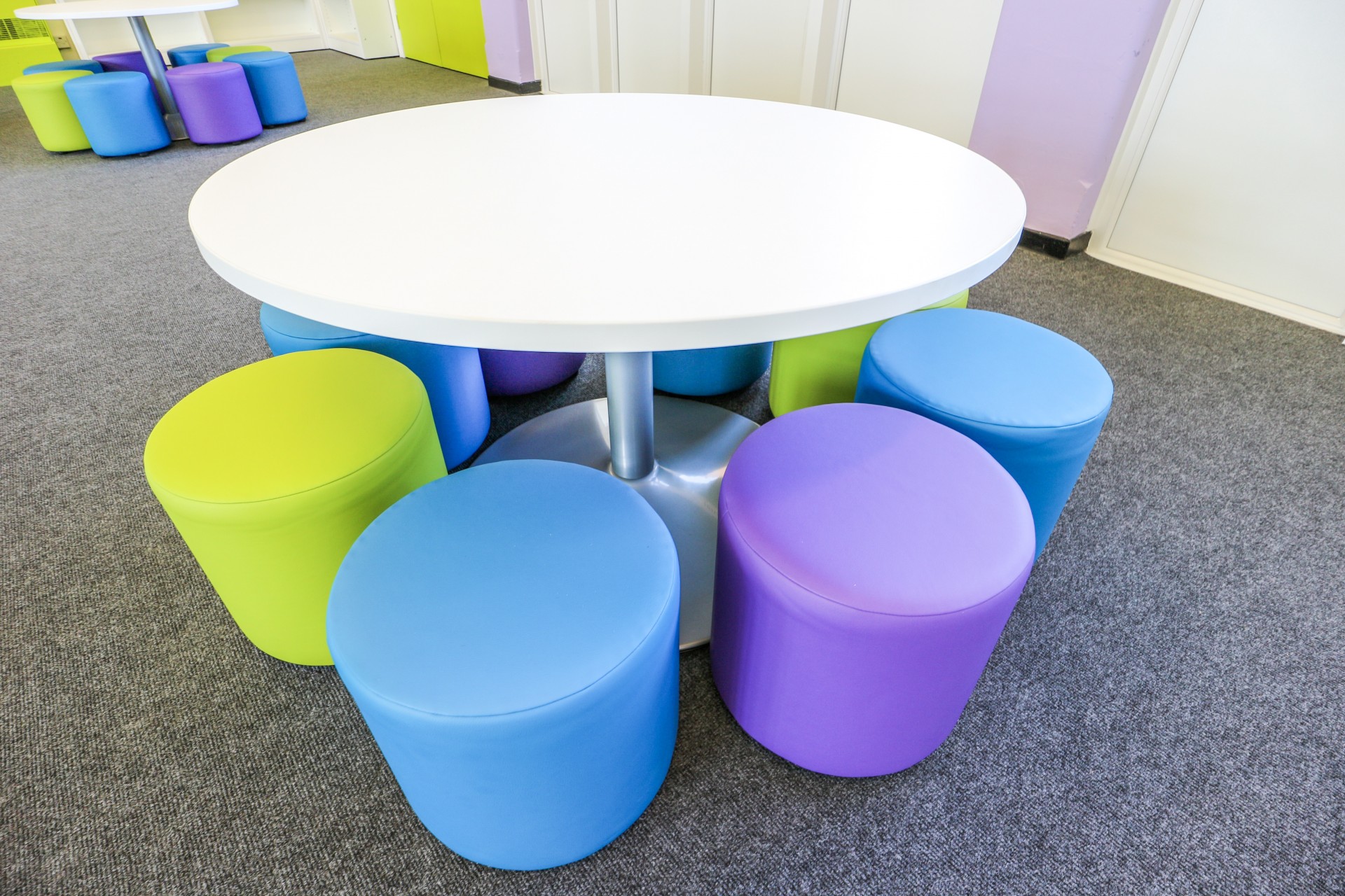 Kindergarten Activity Table with Colorful Pouf Stools
